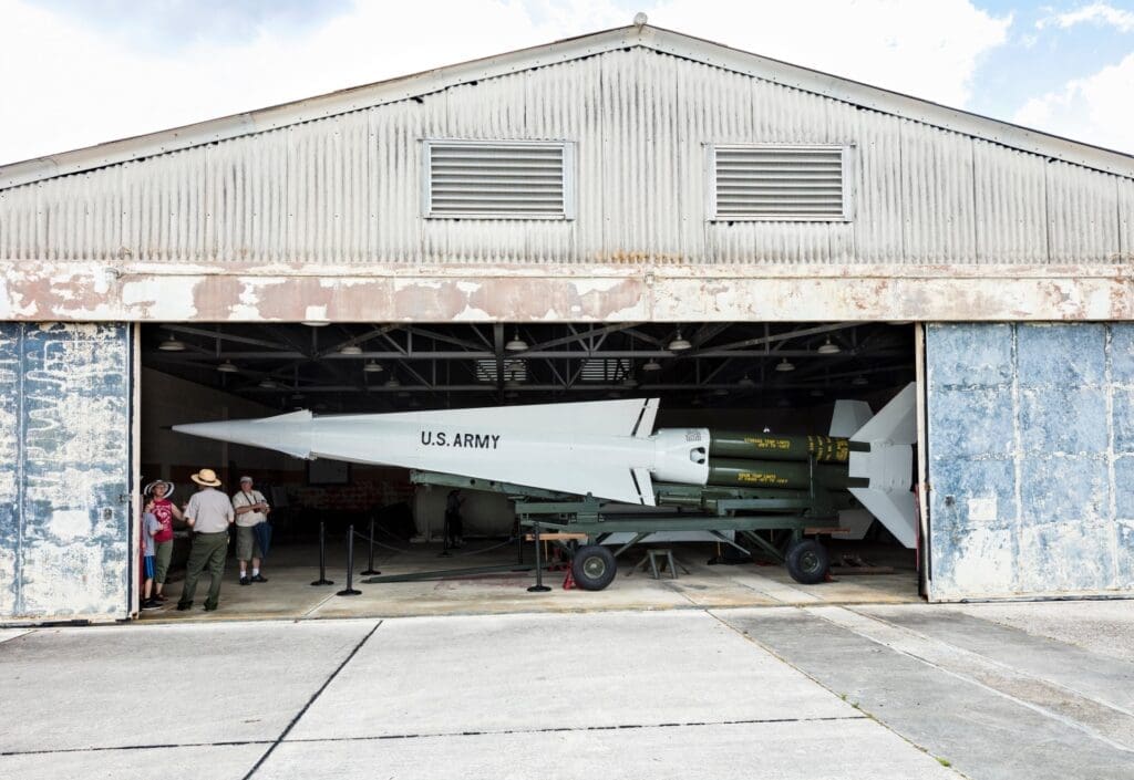 A snapshot of several tourists at the Nike Hercules Missile hangar