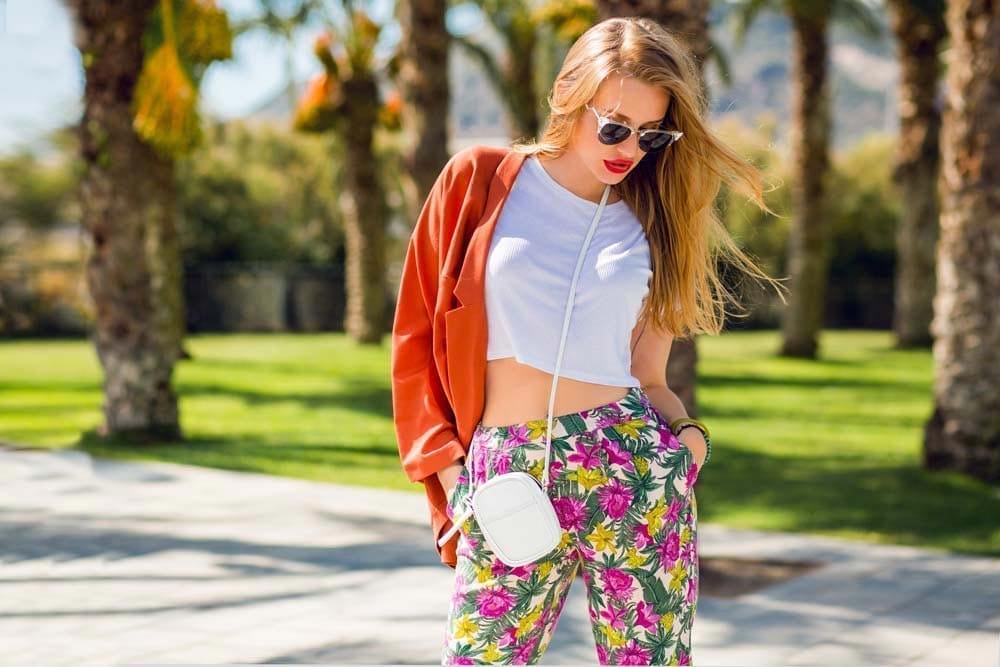 Fashionable woman walking in Miami