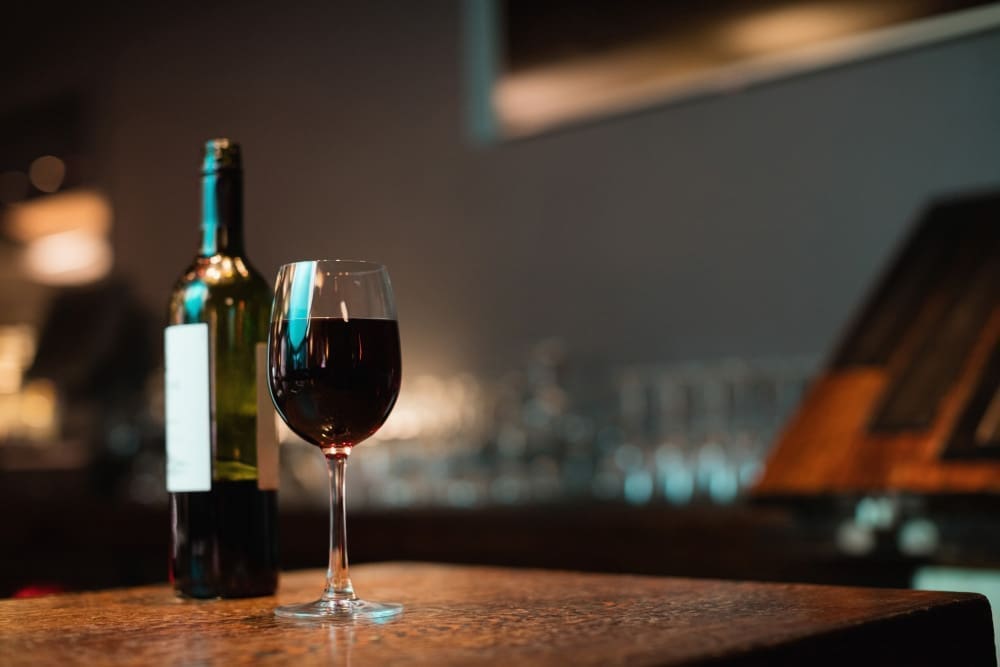 Glass red wine bottle bar counter