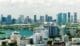 Aerial view of Miami's downtown office district on a bright, sunny day, showcasing towering commercial and residential skyscrapers