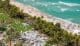 Breathtaking aerial perspective showcasing the Fontainebleau, Miami Beach Boardwalk, and the pristine coastline