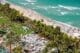 Breathtaking aerial perspective showcasing the Fontainebleau, Miami Beach Boardwalk, and the pristine coastline