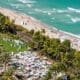 Breathtaking aerial perspective showcasing the Fontainebleau, Miami Beach Boardwalk, and the pristine coastline