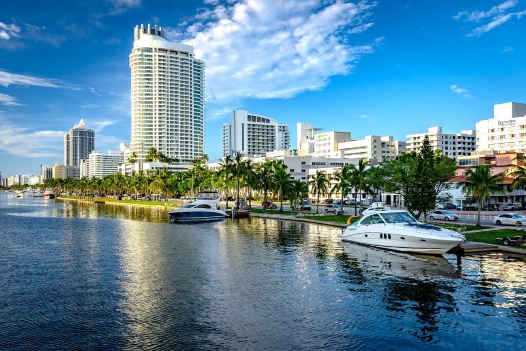 View of Indian Creek and Collins Avenue with buildings in the background of Mid-Beach.