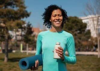 Elderly woman working out in a park setting