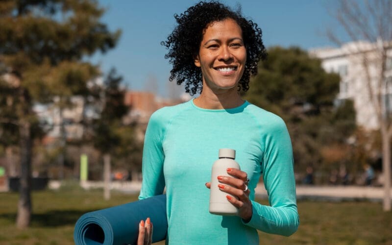 Elderly woman working out in a park setting