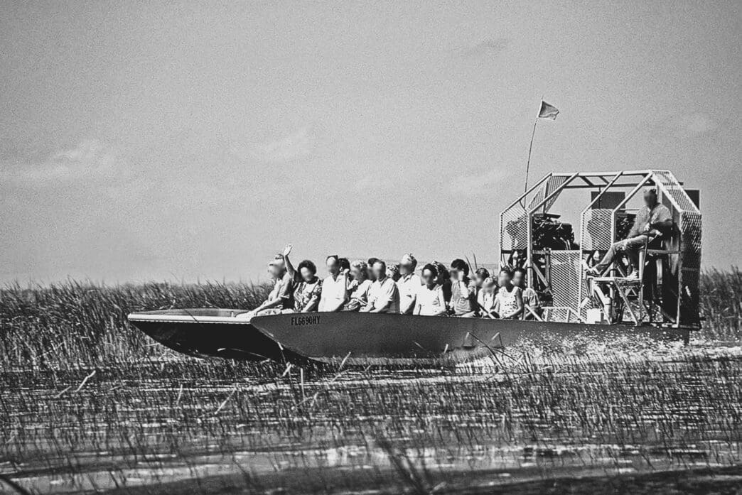 People navigating the swamps of the Seminole region in an airboat