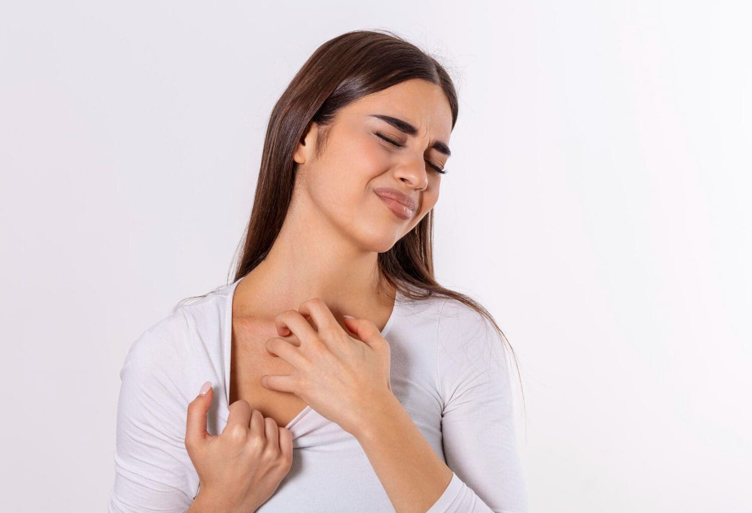 Young woman scratching her neck due to itchy psoriasis