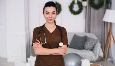 Smiling friendly children's doctor woman with stethoscope wearing brown medical robe health care medical concept