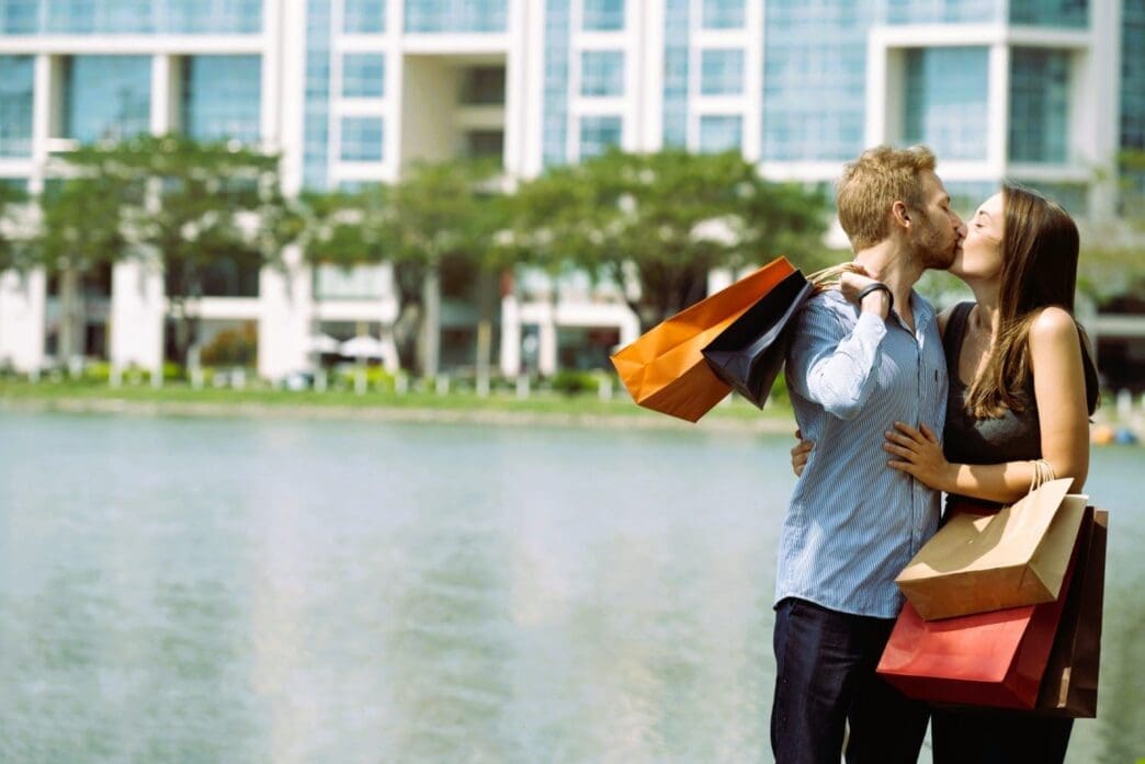 A joyful and excited couple cherishing their time together after a shopping spree