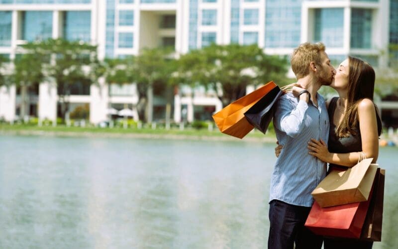 A joyful and excited couple cherishing their time together after a shopping spree