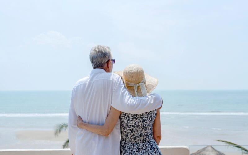 A mature couple enjoying the beauty of a picturesque Florida beach