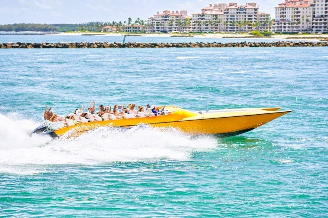 A thrilling speedboat ride through the vibrant blue waters of Miami, offering an exhilarating sense of adventure