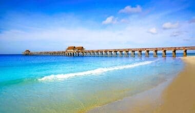 Breathtaking vista of Naples Pier and the shoreline, adorned with its shimmering turquoise waters