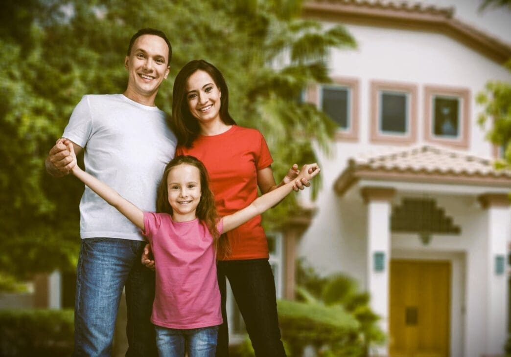 Happy Family Portrait with Their Daughter After Purchasing a New Home