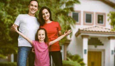 Happy Family Portrait with Their Daughter After Purchasing a New Home