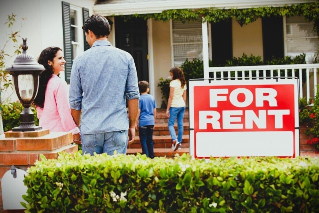 Hispanic family outside home for rent