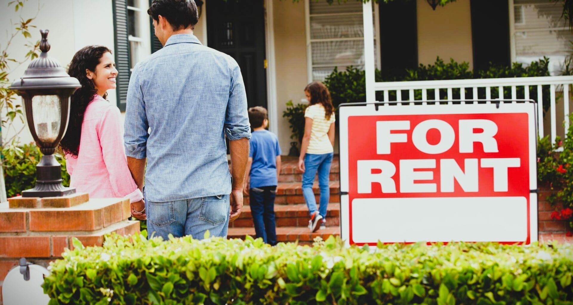 Hispanic family outside home for rent