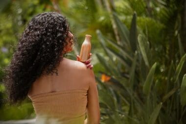 Image of a female spa owner advertising a curly hair shampoo