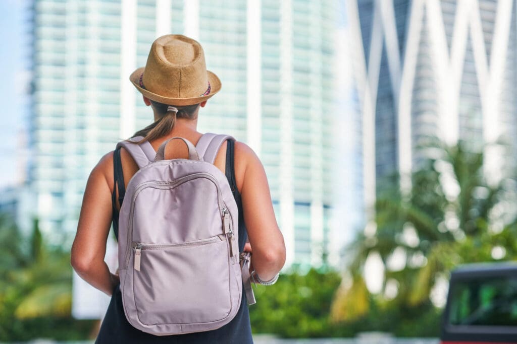 Snapshot of a tourist woman exploring the city’s skyscrapers in Miami