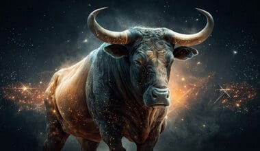 The bull symbolizing Taurus, adorned with prominent horns, stands against a radiant backdrop