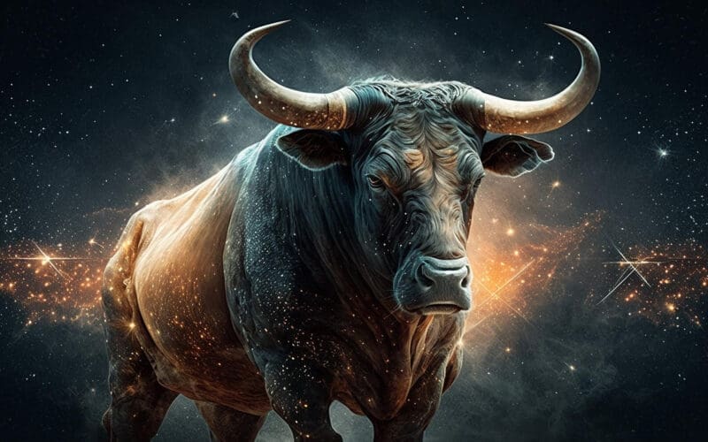 The bull symbolizing Taurus, adorned with prominent horns, stands against a radiant backdrop