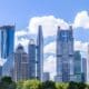 The iconic Oriental Pearl TV Tower stands tall amidst Shanghai's skyline, surrounded by the vibrant energy of the city's financial district