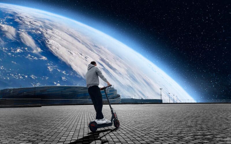 Young men riding electric skateboards, envisioning the future against a backdrop of planet Earth