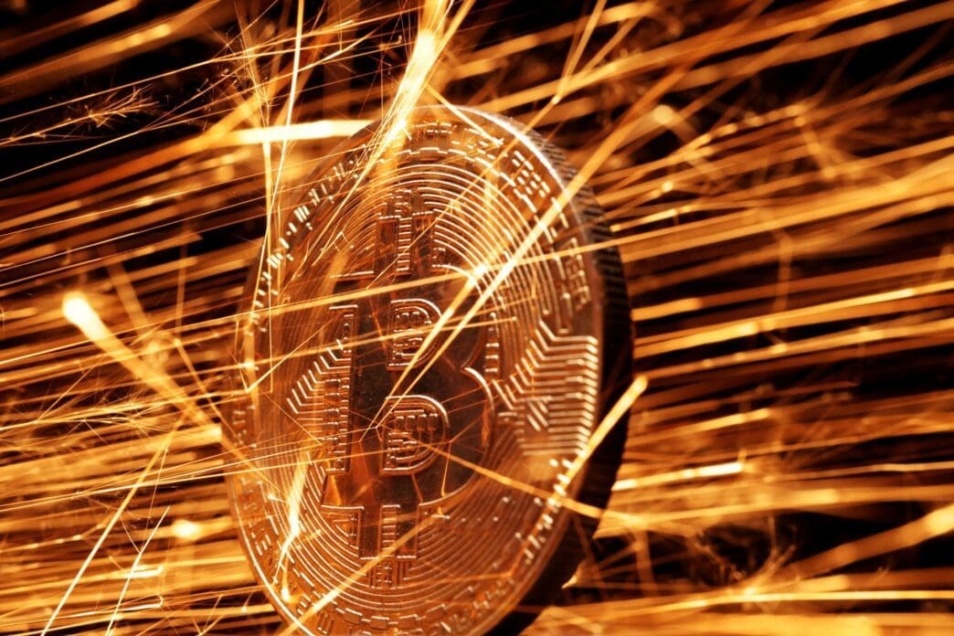 Illustration shows sparks strike representation of cryptocurrency Bitcoin