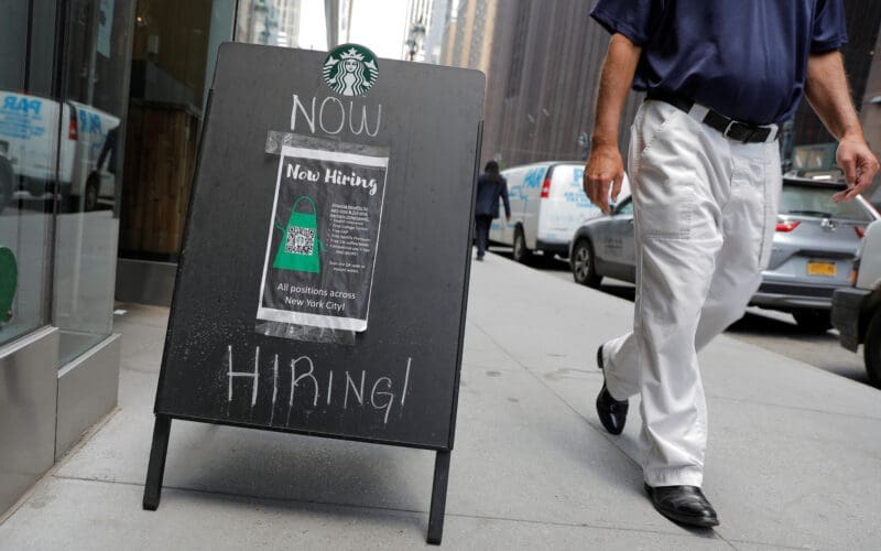 A sign advertising job openings is seen outside of a Starbucks in Manhattan, New York City, New York