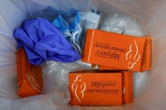 Used packages of Mifepristone, the first pill in a medical abortion, lie in the trash at Alamo Women's Clinic in Carbondale, Illinois