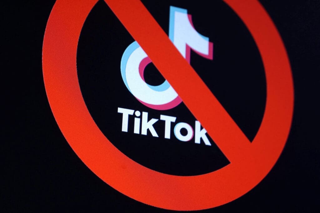 Illustration shows TikTok app logo and forbidden sign