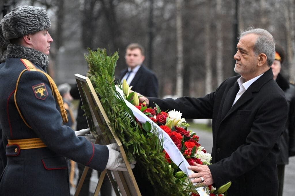 Iran's President Masoud Pezeshkian attends a wreath-laying ceremony at the Tomb of the Unknown Soldier by the Kremlin Wall in Moscow