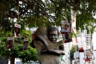 Images of Israeli hostages, who were kidnapped during the deadly October 7, 2023 attack by Hamas, hang from a tree at Hostages Square in Tel Aviv