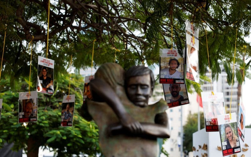 Images of Israeli hostages, who were kidnapped during the deadly October 7, 2023 attack by Hamas, hang from a tree at Hostages Square in Tel Aviv