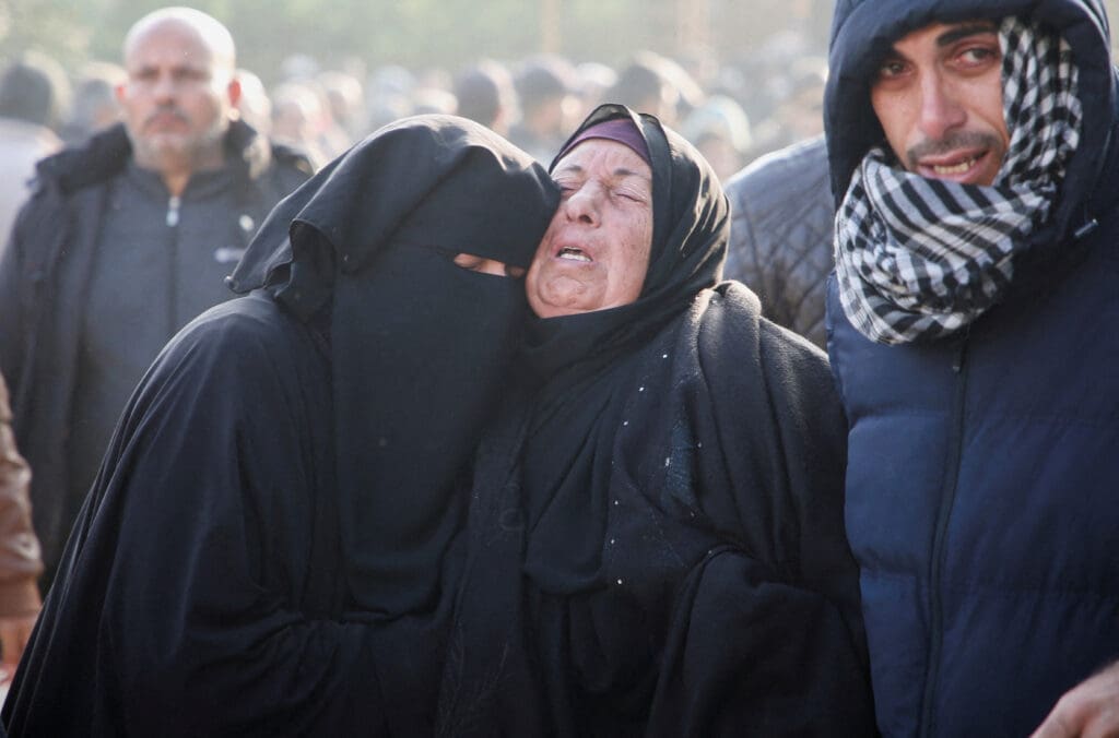Mourners react near the bodies of Palestinians killed in Israeli airstrikes, in Khan Younis