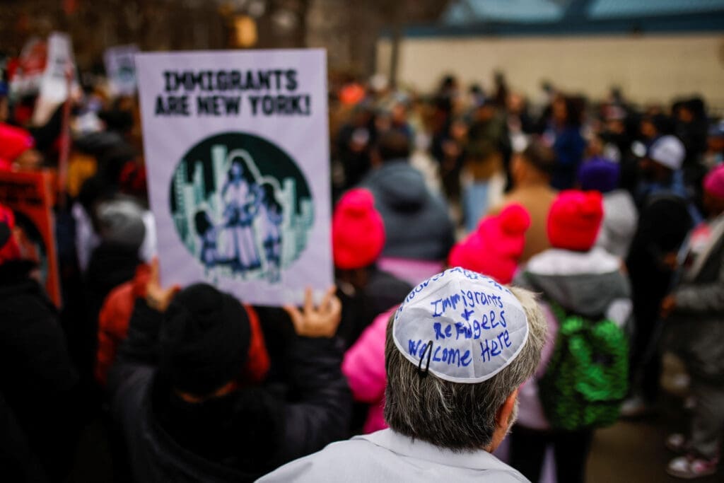 People take part in a rally against Trump's policy of immigration in New York