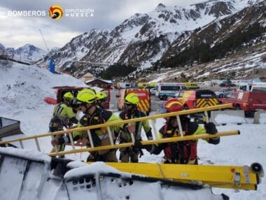 Firefighters work during a rescue operation following a chairlift accident in the Astun ski resort in Huesca