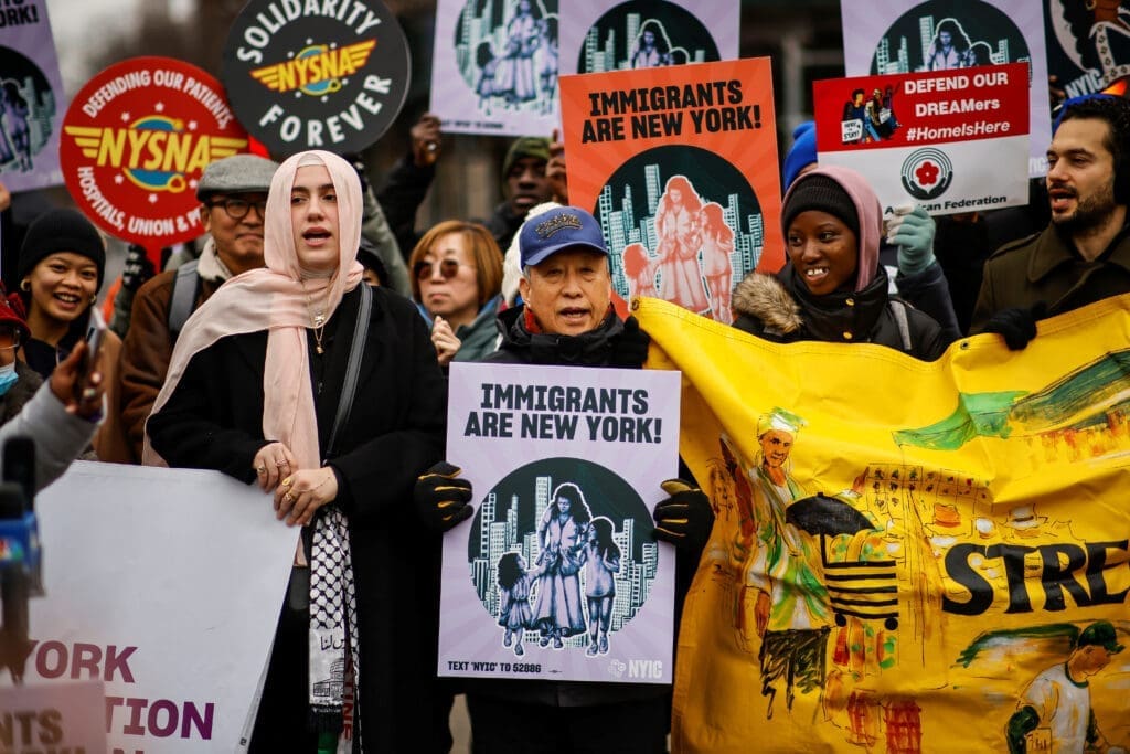 People take part in a rally against Trump's policy of immigration in New York