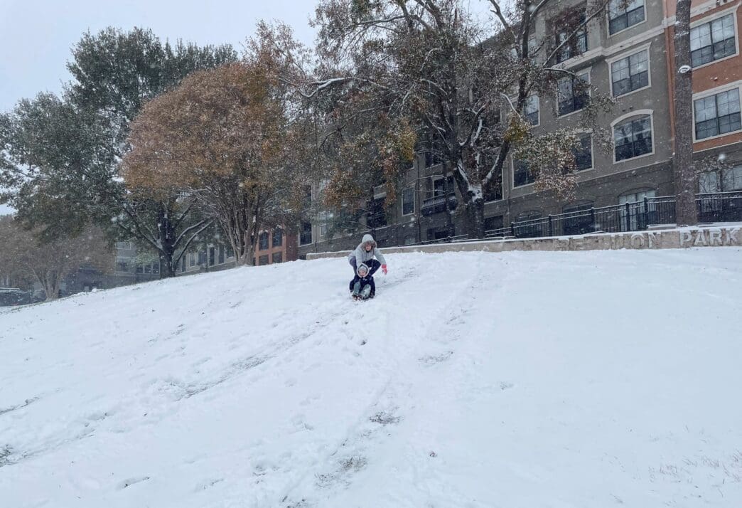Kids play in the snow in Houston, Texas, as winter storm Enzo covers the city in snow