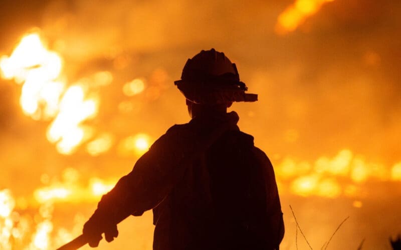 Firefighters and aircraft battle the Hughes Fire near Santa Clarita