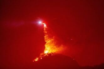 Firefighters and aircraft battle the Hughes Fire near Santa Clarita