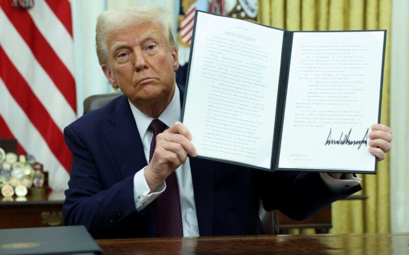 U.S. President Trump signs an executive order in the Oval Office, at the White House