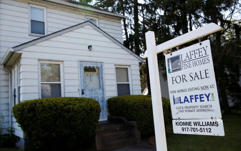 A 'for sale' is seen outside a single family house in Garden City, New York