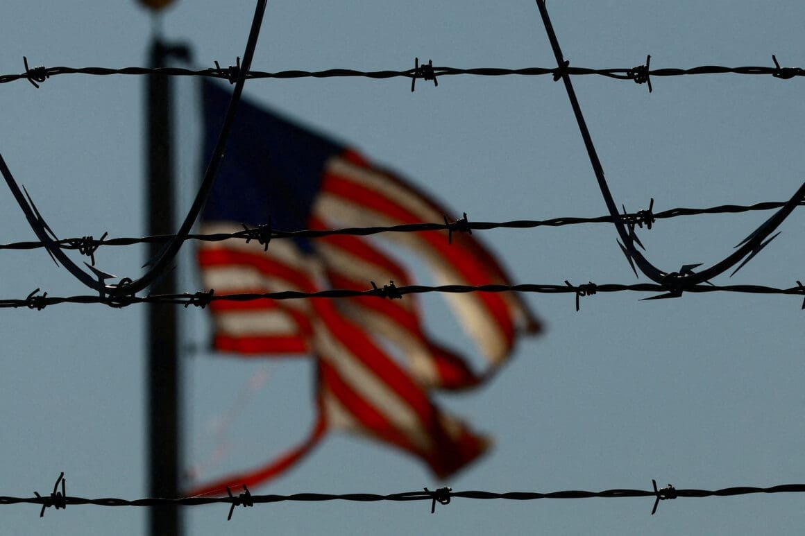 Migrants are transferred to a plane to be expelled from U.S., in El Paso