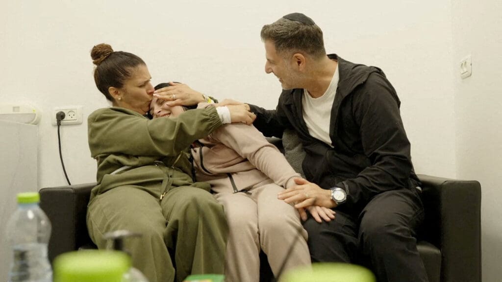 Former Israeli hostage embraces loved ones after being released from Gaza