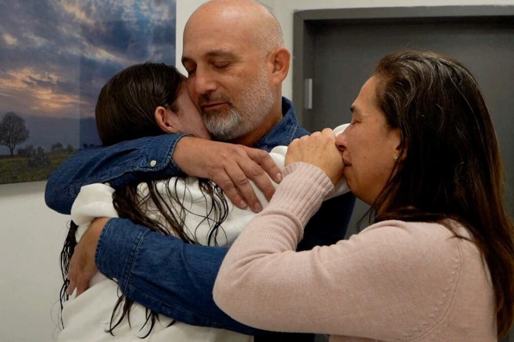 Former Israeli hostage embraces loved ones after being released from Gaza