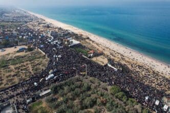A drone view shows displaced Palestinians waiting to be allowed to return to their homes in northern Gaza, in the central Gaza Strip