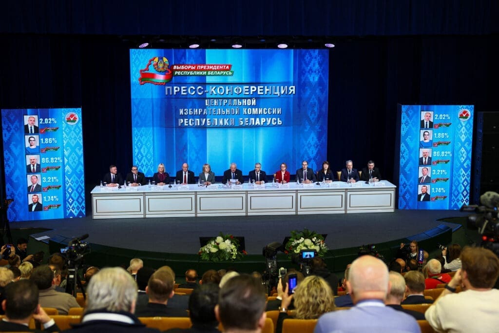 Members of Central Election Commission of Belarus attend a press conference on preliminary results of the presidential election, in Minsk