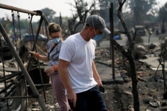 Harper Bishop and wife Cristy survey their home destroyed by the Tubbs Fire in Santa Rosa, California